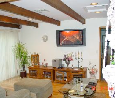 Finished interior room with refined wall treatment